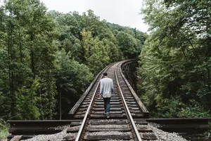 Boy In Railway Forest Wallpaper