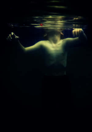 Boy Swimming Underwater Iphone Wallpaper