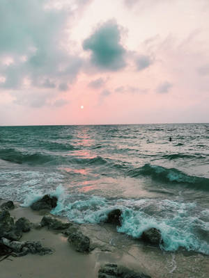 Breathtaking Sunset Over Seashore On An Amazing Iphone Wallpaper