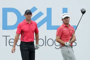 Brian Harman And Rory Mcilroy In Action On The Golf Course Wallpaper