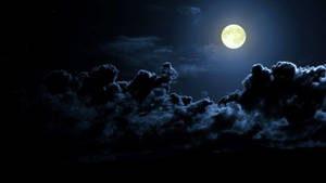 Bright Beautiful Moon And Dark Clouds Wallpaper