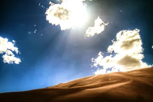 Bright Light Clouds In Mountain Desert Wallpaper