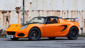 Bright Orange Lotus Elise Wallpaper