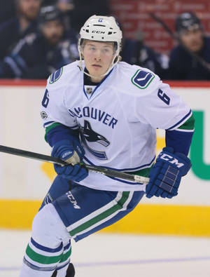 Brock Boeser White Jersey Ice Hockey Game Wallpaper