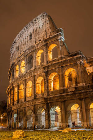 Brown Aesthetic Well-lit Roman Colosseum Wallpaper