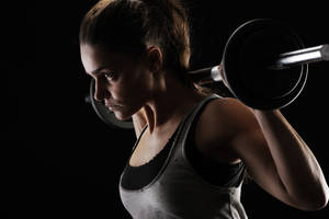 Brunette Woman Weight Lifting Wallpaper