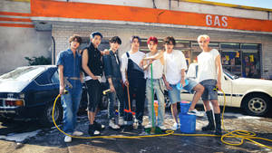 Bts Group Photo At Carwash Station Wallpaper