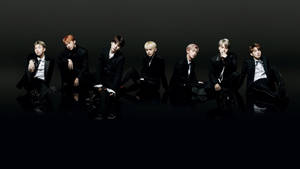 Bts Members In Black On Black Floor Laptop Wallpaper