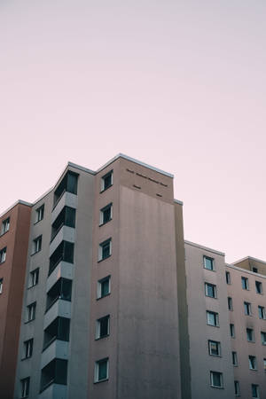 Building Below A Pink Sky Wallpaper