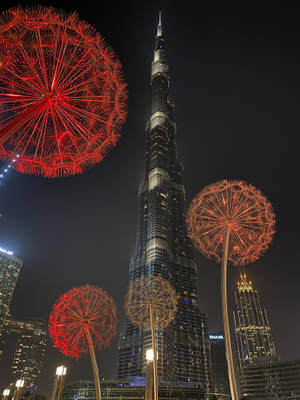 Burj Khalifa With Giant Dandelion Installations Wallpaper
