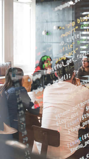 Business Team Meeting Behind Glass Wallpaper