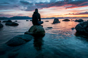 Calm Sea Boy Sit Down Wallpaper