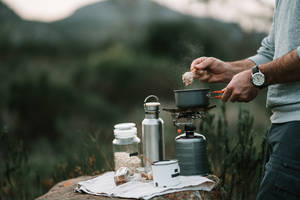 Camper Preparing Oatmeal Wallpaper