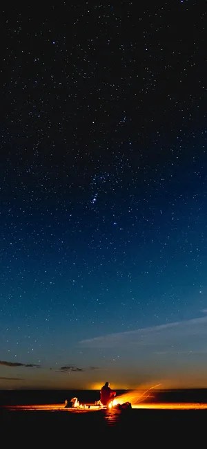 Campfire Starry Night At Beach Wallpaper