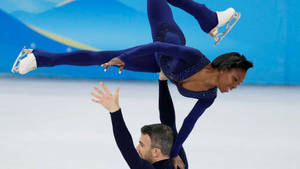 Canadian Figure Skating Pair Vanessa James And Eric Radford In Action Wallpaper