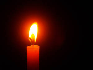 Candlelight In Black Screen Wallpaper