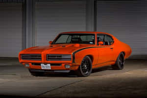 Caption: A Classic Powerhouse - The Pontiac Gto Wallpaper