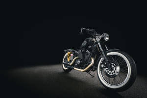 Caption: A Vintage Black Motorcycle Showcasing Antiquity And Elegance Wallpaper