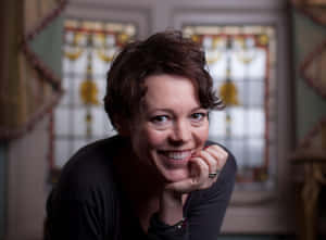 Caption: Academy Award-winning Actress Olivia Colman In An Elegant Pose Wallpaper