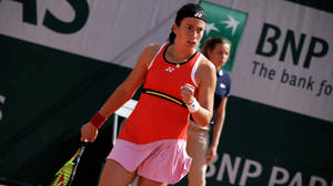 Caption: Anastasija Sevastova In Action With A Red Sleeveless Top Wallpaper