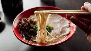 Caption: Authentic Hakata Ramen Served Hot With Chopsticks Wallpaper