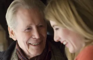 Caption: British Acting Legends Peter O'toole And Leslie Phillips In A Memorable Moment Wallpaper