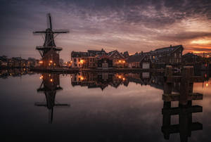 Caption: Captivating Sight Of De Adriaan Windmill, Netherlands Wallpaper