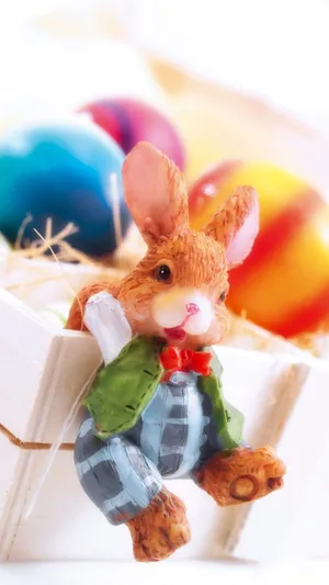 Caption: Delightful Easter Bunny With Colorful Eggs Wallpaper
