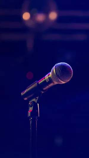 Caption: Dynamic Microphone Ready For Performance Wallpaper