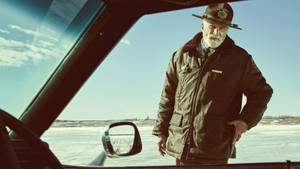 Caption: Elderly Man In Fargo Pondering Life Wallpaper