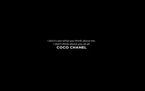 Caption: Elegant Black And White Coco Chanel Aesthetic Laptop View Wallpaper