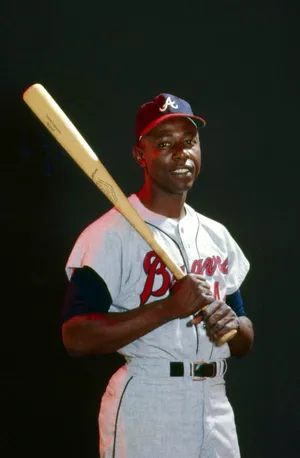 Caption: Hank Aaron In Action - A Tribute To The Home Run King Wallpaper