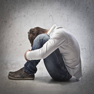 Caption: Heartbroken Little Boy In Tears Wallpaper