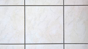 Caption: Impressive Cream-colored Ceramic Floor Tiles Wallpaper