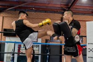 Caption: Intense Kickboxing Training In Action Wallpaper