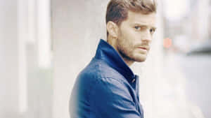 Caption: Jamie Dornan - The Epitome Of Structured Elegance Wallpaper