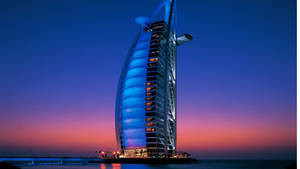 Caption: Majestic Burj Al Arab Against The Minimalist Dubai Skyline Wallpaper