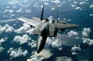 Caption: Majestic Flight Of The Mcdonnell Douglas F-15 Eagle Jet Fighter Wallpaper