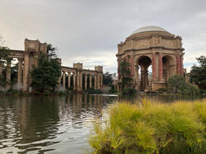 Caption: Majestic View Of The Palace Of Fine Arts By The Lagoon Wallpaper