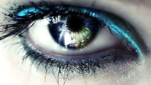 Caption: Mesmerizing Closeup Of An Eye With Metallic Blue Liners Wallpaper