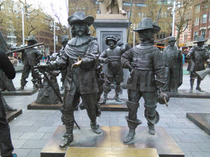 Caption: Nightwatch At Rembrandtplein, Amsterdam Wallpaper