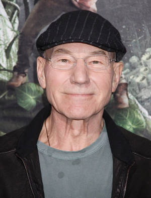 Caption: Patrick Stewart Looking Dapper In Flat Cap Wallpaper