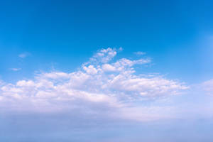 Caption: Peaceful Sunny Day Under The Cloudy Sky Wallpaper