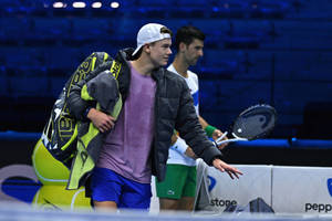 Caption: Rising Star Holger Rune In Mid-action On The Tennis Court Wallpaper