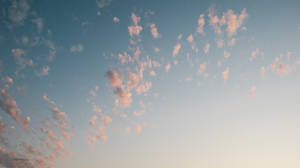Caption: Serenity In Sky: The Aesthetic Of Pink Clouds Wallpaper