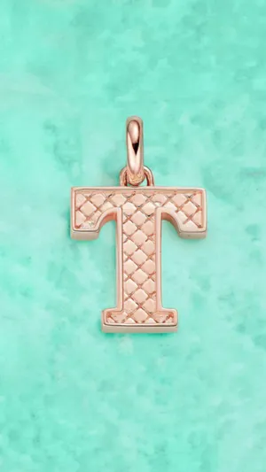 Caption: Shining Letter T Pendant Wallpaper