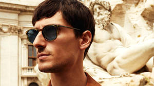 Caption: Show Off A Timeless Look With Salvatore Ferragamo Oval Sunglasses. Wallpaper