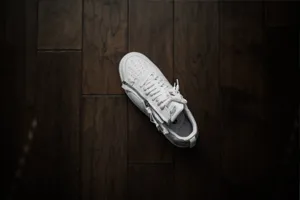 Caption: Showcasing Uniqueness With Nike's Iconic Signature Swoosh Logo Wallpaper