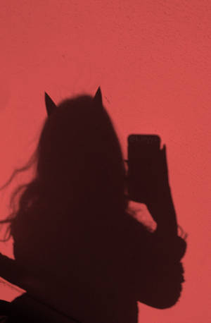 Caption: Surreal Aesthetic Profile - Devil Woman Shadow Wallpaper