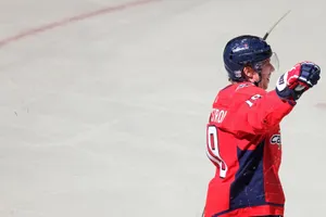 Caption: Swedish Ice Hockey Star Nicklas Backstrom In Action On The Ice Rink. Wallpaper
